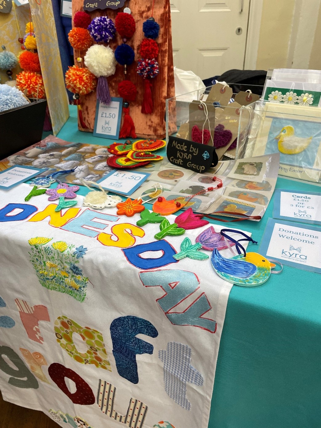 The Kyra craft stall covered in handmade broaches, cards, badges and more, for “Upcoming Courses at Kyra – What’s new 